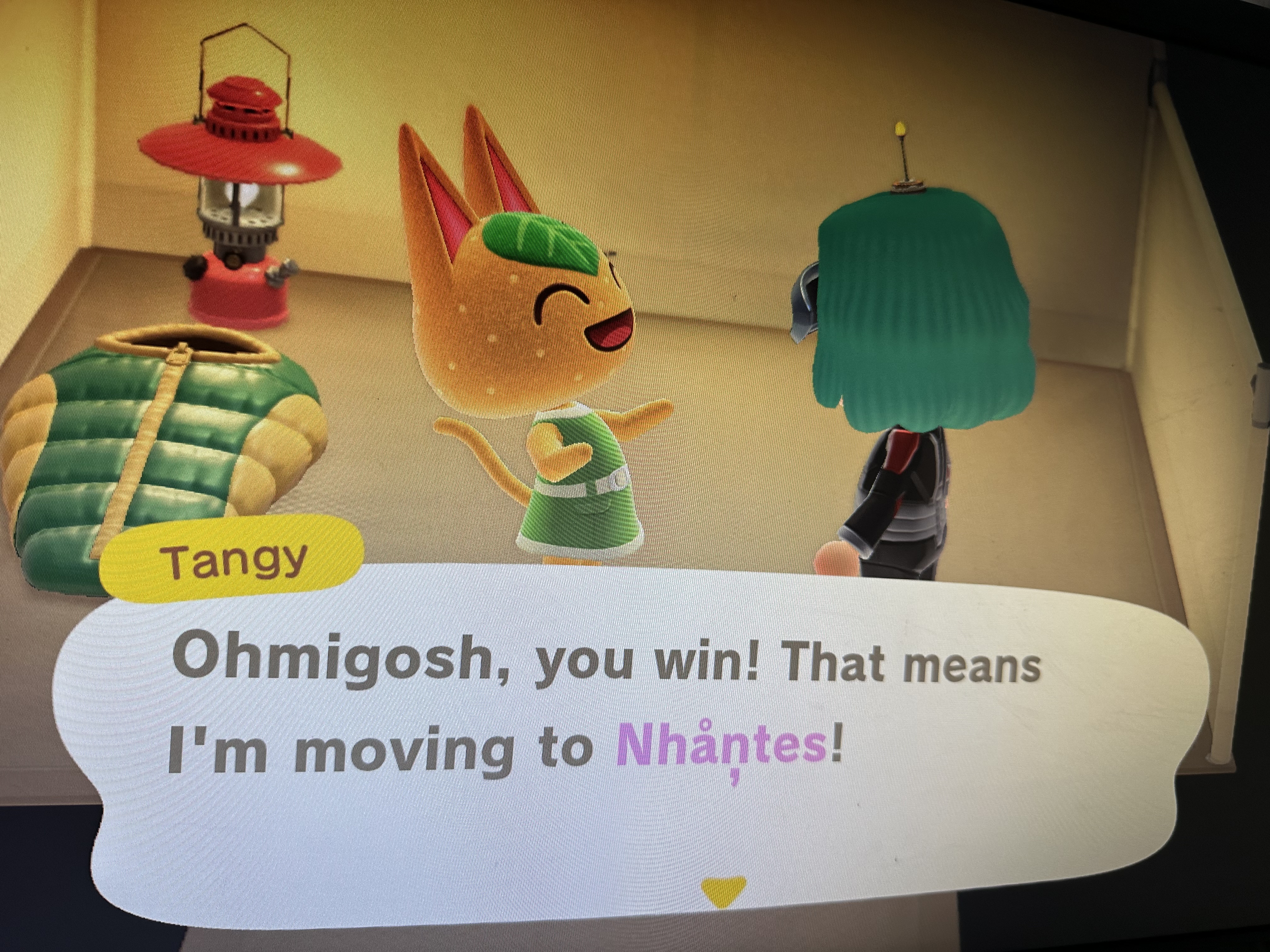 Gros plan de l'écran de la Nintendo Switch, où Tangy s'exclame "Ohmigosh, you win! That means I'm moving to Nhantes!" avant de réaliser que ce n'est pas possible.